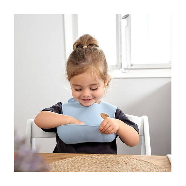 SMILE niebieski silikonowy śliniak z kieszonką Happy Rascals sky blue