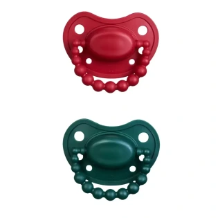 Smoczek pozycjonujący zestaw świąteczny 2 smoczków HOLY GREEN i SANTA RED 6M+ LUU Kids